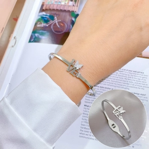 Minimalist silver titanium steel butterfly bangle with LOVE engraving and crystal accents