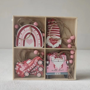 Close-up of Valentine wooden ornaments set in a four-grid box with love themes