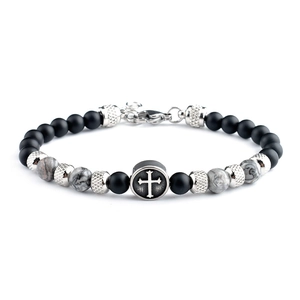 Detail of 6mm tiger eye stone beads and stainless steel cross charm on a vintage bracelet