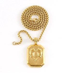 Macro view of 18K gold stainless steel square pendant with 3D embossed dragon detail