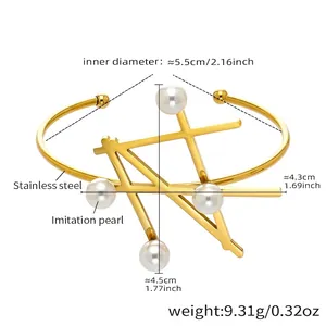 Detailed view of gold stainless steel bangle with imitation pearls and geometric bars