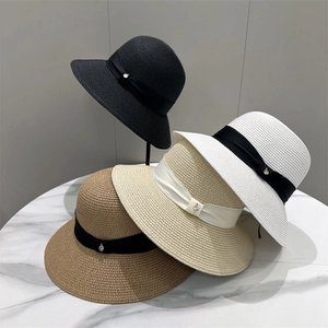 Elegant wide brim straw sun hat for women with ribbon bow in multiple summer colors