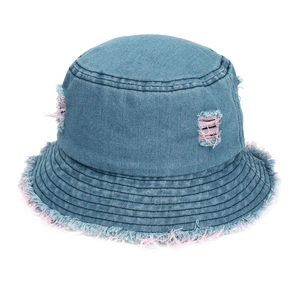 Distressed blue denim bucket hat with stylish pink fringe and frayed details for sun protection