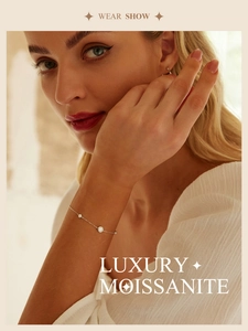 Close-up of model wearing a 925 sterling silver moissanite star bracelet in soft light