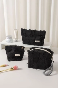 Three-piece set of black fringed cotton linen cosmetic bags with stylish tassel details