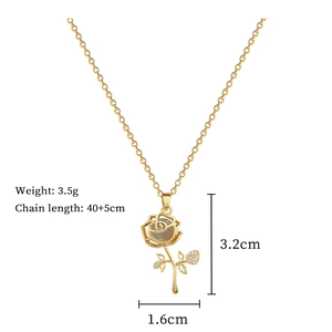 Detailed view of golden flower necklace pendant with dimensions and weight specifications