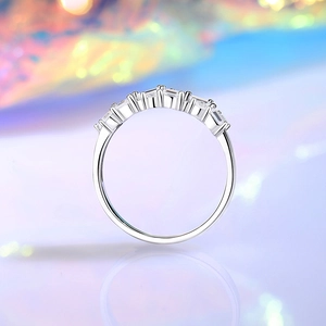 Minimalist S925 sterling silver ring with rectangular zircons on a colorful background