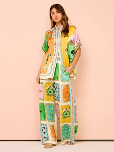 Detailed view of bohemian floral print and smooth silk texture on women's casual set