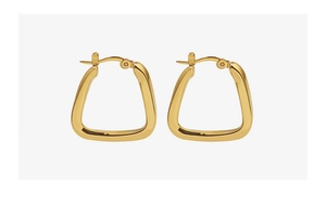 Macro detail of geometric U-shaped hoop earrings in 18K gold plated titanium steel