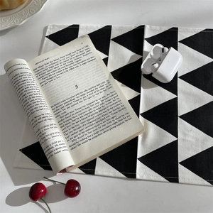 Modern black and white geometric placemat with triangle pattern for dining table decor