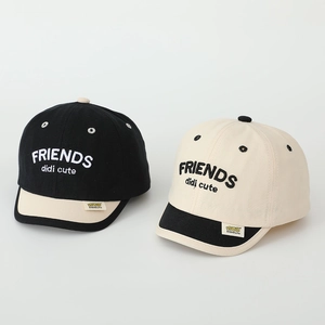 Close-up of cotton canvas baseball cap with FRIENDS embroidery and brand label detail