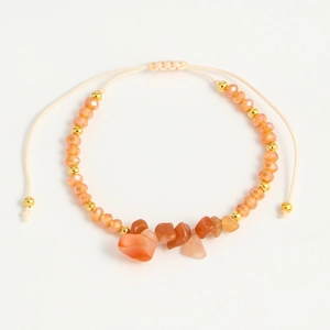 Handmade bohemian anklet with orange crystal beads and natural stones on beige cord