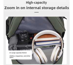 Detailed macro view showing the high-capacity grey lining and internal storage of the green backpack