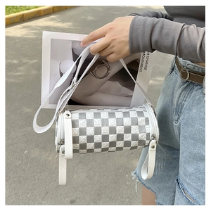 Silver checkered cylinder crossbody bag with white PU strap and metallic zipper detail