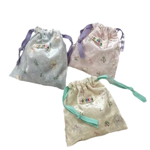 Three-piece set of cartoon bear drawstring storage bags in blue, pink, and beige velvet