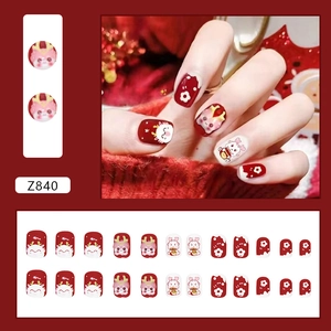 Short burgundy Year of the Dragon press-on nails with cute floral and rabbit designs