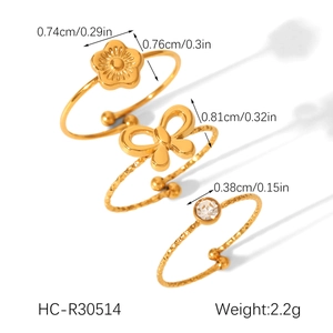 Detailed view of 18K gold plated bow and flower rings with zircon size specifications