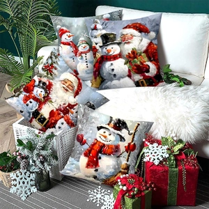 Set of four Christmas pillow covers with Santa and snowman prints for festive home decor