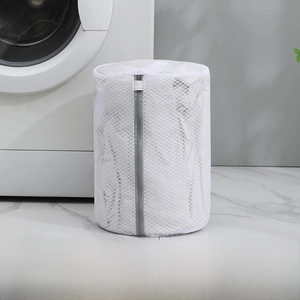 Macro view of a 22x33cm milky white honeycomb mesh laundry bag with grey zipper