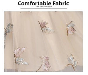 Detailed view of champagne mesh fabric with 3D butterfly sequin and gold thread embroidery