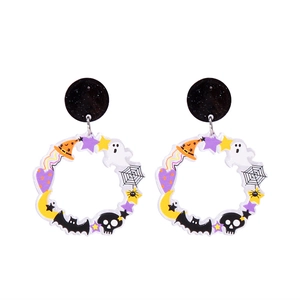 Macro shot of Halloween acrylic earrings featuring ghost, bat, moon and star charms