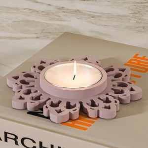 Macro view of floral pattern candle holder in dusty rose matte silicone mold finish