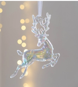 Close-up of a clear iridescent Christmas elk ornament with a white hanging ribbon