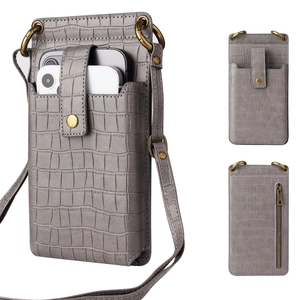 Detail view of grey crocodile pattern crossbody phone bag with adjustable strap and zip pocket