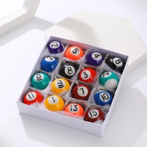 Macro shot of a 16-piece set of mini resin billiard ball keychains in a white gift box
