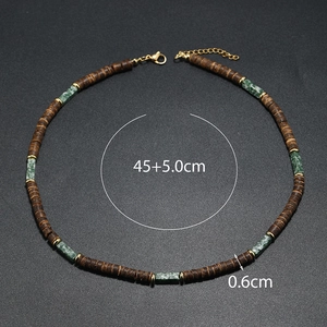 Detailed shot of ethnic necklace with brown wood beads and size specs 45 plus 5cm