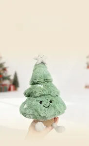 Detail of plush Christmas tree toy with shiny silver star and cute embroidered face