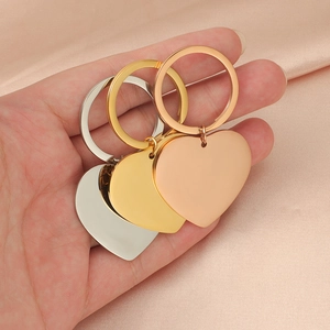 Polished heart-shaped stainless steel keychains in gold, silver, and rose gold finishes