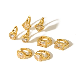 Gold plated stainless steel hoop earrings set with heart and geometric crystal charms