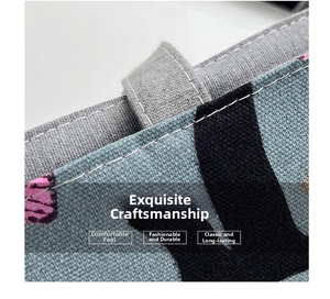 Close-up of durable canvas tote with cat silhouette print and reinforced stitching