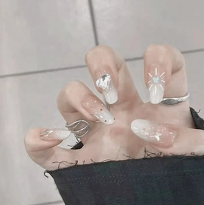 Pink and white gradient press-on nails with heart rhinestones and silver glitter accents