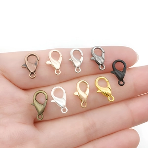 Variety of 12mm colorful zinc alloy lobster clasps for jewelry making held in hand
