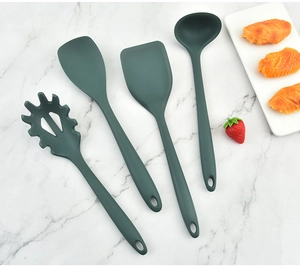 Deep green 4-piece silicone kitchen utensil set featuring spatula and soup ladle tools