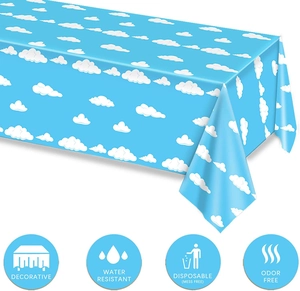 Detail of blue sky cloud tablecloth showing water resistant and odorless features