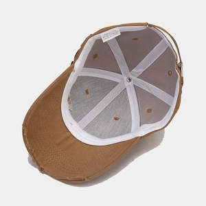 Internal view of the brown cotton baseball cap with reinforcing tape and distressed brim