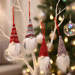 Set of 4 Christmas gnome ornaments with red and grey knitted hats hanging on branches
