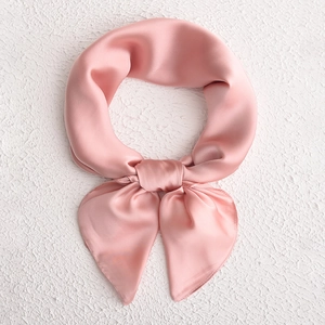 Pink satin square silk scarf tied in a knot, elegant minimalist accessory for women