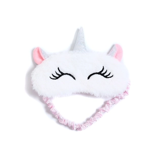 Detailed view of plush unicorn sleep mask with soft white faux fur and silver horn