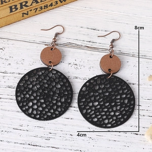 Detailed view of vintage geometric wood earrings showing the 8cm by 4cm dimensions