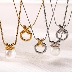Cross pendant necklaces with 18k gold plating and pearls in layered arrangement