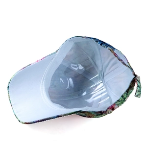 Close-up of colorful abstract floral print and clean interior stitching on baseball cap