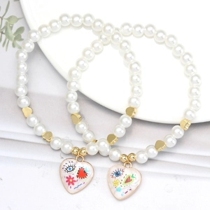 Set of 2 faux pearl heart bracelets with colorful graffiti enamel charms and gold spacers