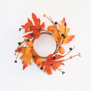 Autumn maple leaf candle ring with mini pumpkins and berries for Halloween decor