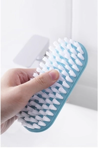 Detail of blue handle cleaning brush with soft white bristles for laundry and shoes