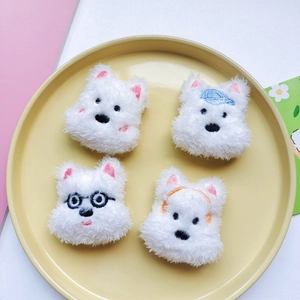 Set of four cute white plush West Highland Terrier puppy accessories in various styles