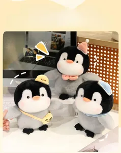 Detailed view of plush penguin toys wearing colorful party hats and miniature accessories